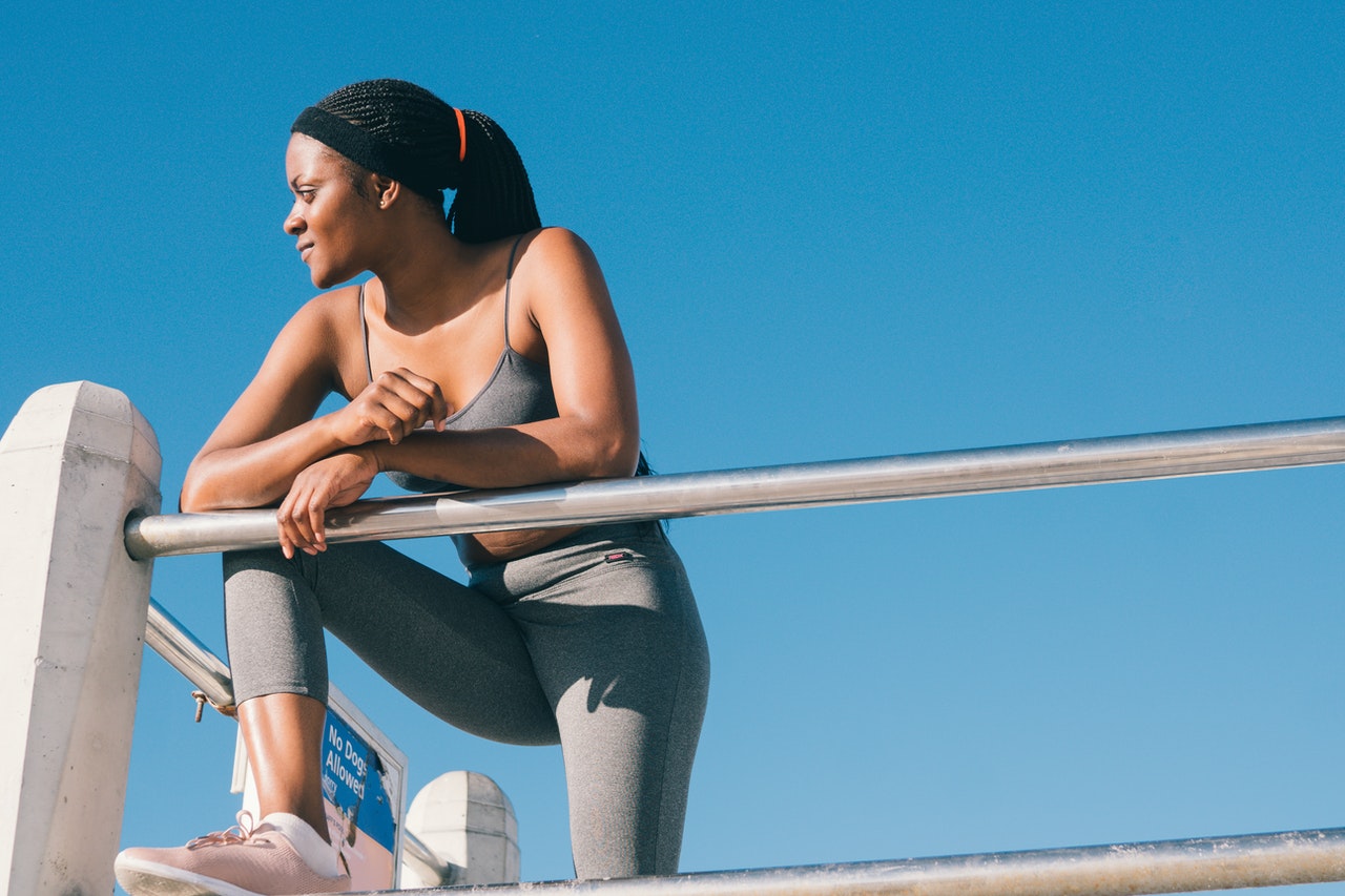 woman taking a break from her jog