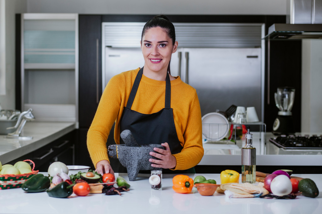 Young mother preparing a healthy meal for the family.